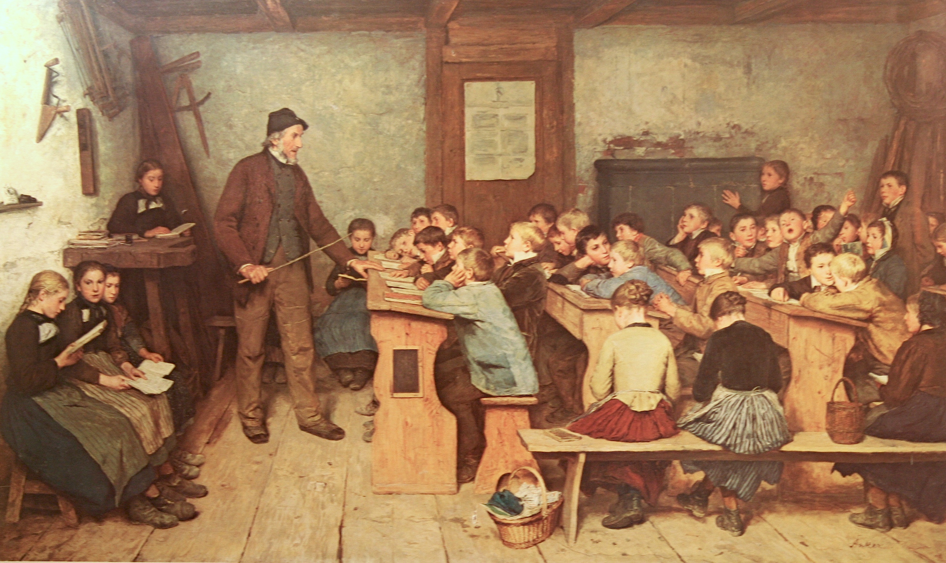 Albert Anker’s painting of a village school in 1848: an old schoolmaster at his desk and rows of children on benches reading from their books.